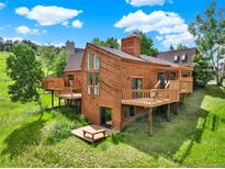 Beautifully designed wood home with a large deck, perfect for enjoying the outdoors at 953 Gilia Dr, Golden, CO 80401