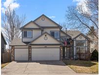Charming two-story home featuring a two-car garage, stone accents, and a well-maintained front yard at 5010 Apache Creek Rd, Castle Rock, CO 80109