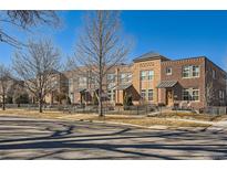 Charming brick townhomes featuring well-maintained landscaping and inviting curb appeal in a desirable neighborhood at 1909 S Logan St, Denver, CO 80210