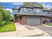Charming two-story home with attached two-car garage and well-maintained front yard at 761 Carr St, Lakewood, CO 80214