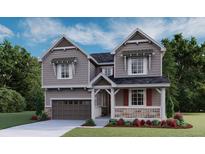 Charming two-story home featuring a covered porch, attached garage, and professional landscaping at 1361 Lumber Ridge N Cir, Erie, CO 80516