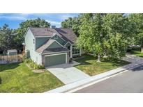 Charming two-story home with landscaped yard and attached two car garage at 19428 E Crestridge Cir, Centennial, CO 80015
