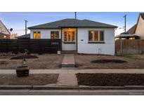 Charming single-story home with a well-maintained yard and inviting front entrance at 2855 Albion St, Denver, CO 80207