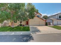 Charming two-story home with a well-maintained lawn, mature trees, and a three-car garage at 3556 Buffalo Ave, Broomfield, CO 80020