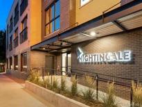 Exterior shot of the well-lit building entrance at 2120 N Downing St # 216, Denver, CO 80205
