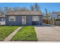 Charming single-story home features a well-maintained front yard and convenient driveway with carport at 2080 S King St, Denver, CO 80219