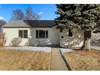 Charming home featuring mature landscaping, a well-maintained yard, and a welcoming walkway at 3460 S Eudora St, Denver, CO 80222