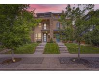 Inviting townhome featuring meticulous landscaping and modern architectural details, set against a vibrant sunset sky at 4170 Vrain St, Denver, CO 80212