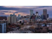 Incredible city view showing the Denver skyline at dusk, with its iconic buildings lit against a colorful sky at 800 N Pearl St # 1211, Denver, CO 80203