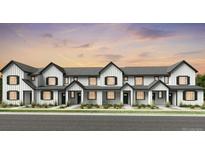 New construction exterior elevation of townhomes in a row with white siding and black trim and a beautiful sunset at 6641 E 148Th Dr # 4, Thornton, CO 80602