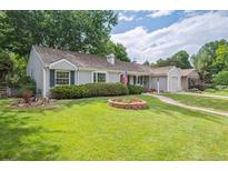Charming single-story home featuring well-maintained lawn, lush landscaping and a welcoming curb appeal at 3225 S Race St, Englewood, CO 80113