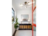 Bright entryway featuring modern lighting, accent furniture, and stylish decor at 2524 Zenobia St, Denver, CO 80212