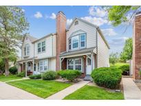 Charming townhome featuring a landscaped front yard and classic architectural details at 3078 W 107Th Pl # D, Westminster, CO 80031