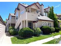 Inviting two-story townhome with well-maintained landscaping and a private balcony at 8361 S Upham Way # 209, Littleton, CO 80128