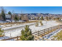 Community walking path with snowy landscape and mountain views at 8115 Monte Vista Cir, Littleton, CO 80125