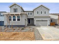 Charming two-story home features a two-car garage and lovely landscaping at 2560 Wesley Ln, Lafayette, CO 80026