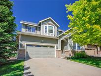Charming two-story home with a well-manicured lawn and a spacious two car garage at 6525 S Abilene St, Englewood, CO 80111