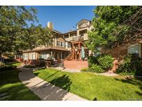 Beautiful two-story condo featuring manicured landscaping and a community courtyard at 6001 S Yosemite St # B206, Greenwood Village, CO 80111