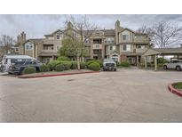 Charming condo building with assigned parking and well-maintained landscaping, perfect for convenient living at 4760 S Wadsworth Blvd # M302, Littleton, CO 80123