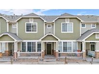 Inviting exterior of the home showcasing its well-maintained facade and front porch at 15945 E Geddes Dr # 54, Aurora, CO 80016
