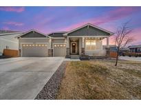 Charming single-Gathering home featuring a welcoming front porch and a spacious three-car garage at 14632 Longhorn Dr, Mead, CO 80542