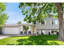 Charming two-story home with a well-manicured lawn and inviting curb appeal on a bright, sunny day at 7132 Xavier Way, Westminster, CO 80030