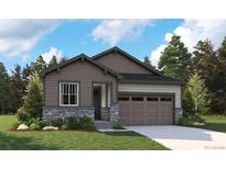 Charming single-Gathering home showcasing a stone facade, complemented by a well-manicured lawn and an attached two-car garage at 2657 Sawyer Ln, Erie, CO 80026