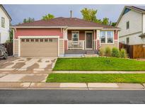 Charming single-Gathering home with a well-maintained lawn and an attached garage, perfect for suburban living at 426 N 48Th Ave, Brighton, CO 80601