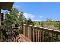 Enjoy the view from this balcony with a table and chairs, ideal for relaxation at 44 S Holman Way, Golden, CO 80401