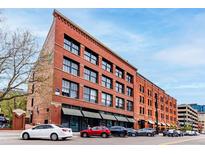 Stunning brick building with large windows and street parking in an urban area at 1745 Wazee St # 5E, Denver, CO 80202