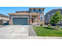 Charming two-story home with a well-manicured lawn and a two-car garage for comfortable suburban living at 18189 House Finch Ln, Parker, CO 80134