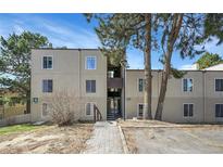 Exterior shot of a charming condo complex with well-maintained landscaping and inviting entrance at 9700 E Iliff Ave # D44, Denver, CO 80231