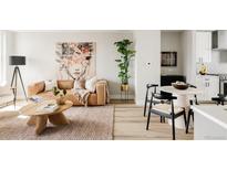 Bright living room featuring a modern design with a comfortable leather sofa and stylish decor, perfect for relaxation at 8280 E 36Th Ave # 27, Denver, CO 80238