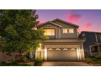 Charming two-story home with a well-maintained lawn and inviting curb appeal at 10262 Spotted Owl Ave, Highlands Ranch, CO 80129