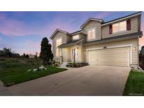 Charming two-story home with landscaped yard and a two-car garage, perfect for suburban living at 408 Sylvestor Trl, Highlands Ranch, CO 80129