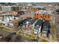 Modern townhomes featuring sleek design and balcony views in a vibrant urban setting with mountain views at 2451 Lawrence St # 2, Denver, CO 80205