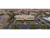 Aerial view of a commercial building with ample parking and landscaping in an urban area at 5700 S Quebec St # A, Englewood, CO 80111