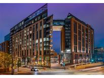Striking exterior view of a contemporary building with a unique skybridge connecting the two towers at 1901 Wazee St # 1020, Denver, CO 80202
