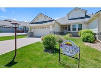 Charming single-Gathering home with a well-maintained lawn and a two-car garage, located in a friendly neighborhood at 7879 S Zante Ct, Aurora, CO 80016