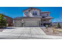 Charming two-story home with a three car garage and a well-manicured front yard at 145 Kettle Valley Way, Monument, CO 80132