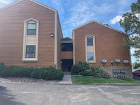 Exterior shot of a brown two story condo with stone accents and well maintained landscaping at 4281 S Salida Way # 5, Aurora, CO 80013