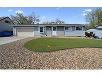 Charming home featuring a well maintained front yard with rock landscaping at 8731 W 89Th Pl, Broomfield, CO 80021