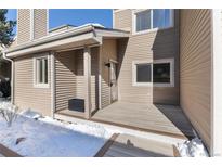 Private entrance and deck with winter scene at 6980 Fargo Trl, Littleton, CO 80125