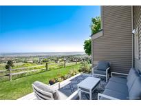 Inviting patio featuring comfortable seating and stunning views of the surrounding landscape at 6980 Fargo Trl, Littleton, CO 80125