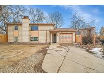 Ranch style home with attached garage and mature trees at 1262 Lanyon Ln, Longmont, CO 80503
