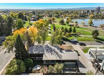 Stunning aerial view of the home in a park-like setting, with mature trees and a glimpse of a hot tub at 1901 Meade St, Denver, CO 80204