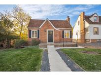 Brick ranch home with a landscaped yard and walkway at 915 19Th St, Golden, CO 80401