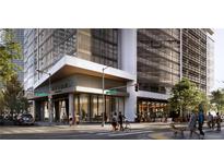 Upscale building exterior featuring modern architectural design, prominent signage, and a vibrant streetscape at 525 18Th St # 1102, Denver, CO 80202