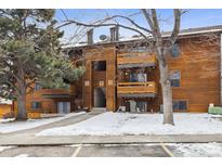 Attractive exterior of a wood-sided multi-unit building with parking and landscaping at 337 Wright St # 207, Lakewood, CO 80228