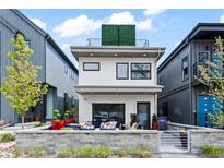 Modern two-story home featuring a sleek design and a welcoming patio area, plus a rooftop terrace at 3540 Pecos St, Denver, CO 80211